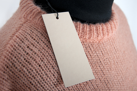 part of knitted peach sweater with blank labelの写真素材