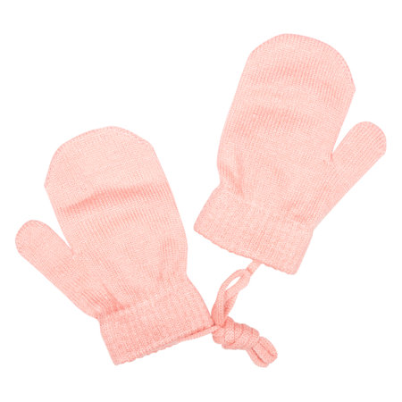 pink gloves for a baby girl isolated on a white backgroundの写真素材