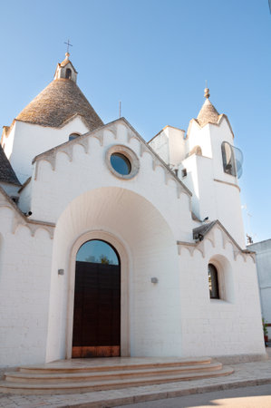 traditional style church in Alberobello, Puglia region, Italyの写真素材