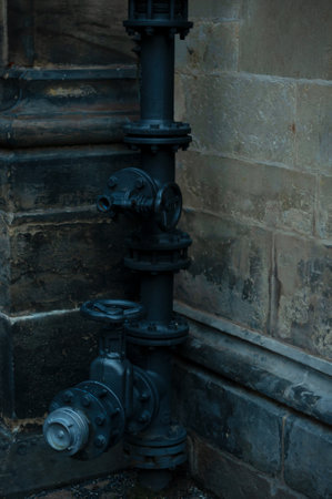 old water pipe outside the buildingの写真素材
