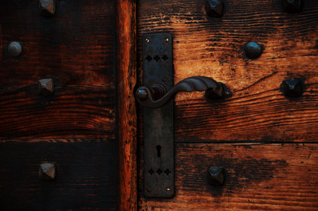 handle on an old wooden door in Italyの写真素材