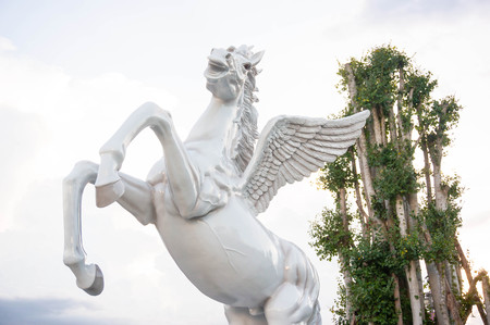 The flying horse statue on the sky with clouds.の写真素材