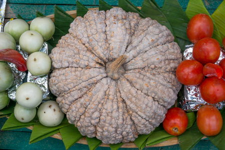 pumpkin tomato and thai eggplant in basket on the table.