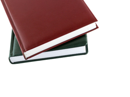 Book. Brown and green leather notebook isolated on white background.の写真素材