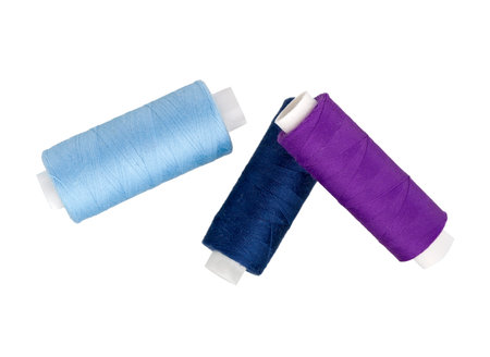  Sewing thread spool of different colors isolated on white.