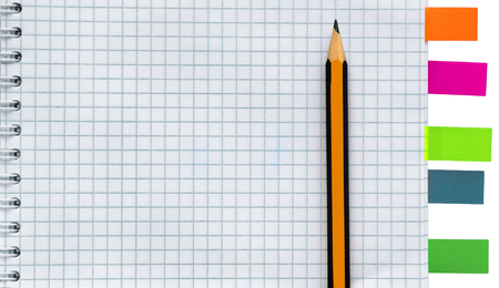 Blank notebook with pencil and stickies isolated on white backgroundの写真素材