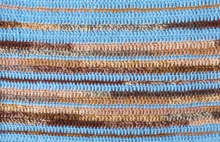 Knit pattern. Close-up of knitted wool texture. Multicolored pattern knit as background.の写真素材
