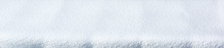 Panoramic winter background with snowy pattern. Natural snow texture.