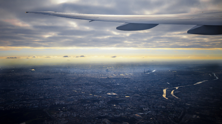 Aeriel view of Paris city and plane wingの写真素材