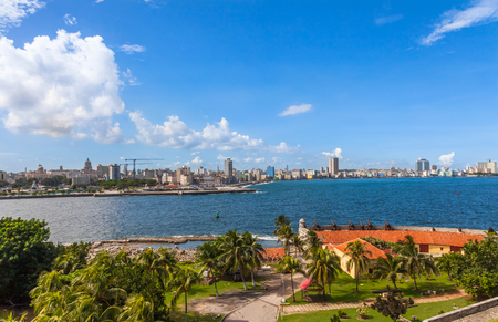 Cuba. View from Morro Castle to the Havana City and Malecon, wide pedestrian walkway alongside the ocean, peppered with historic monuments and hotels.の写真素材