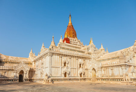 Ananda Temple in  Old Bagan, Myanmar. The Buddhist temple houses four standing Buddhas, each one facing the cardinal direction of East, North, West and South.の写真素材