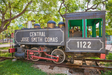 Old steam train locomotive, used on Cuba's sugar plantations at the Parque de los Agrimensores next to the train station "Estacion Central de Ferrocarriles" in Havana, Cuba.のeditorial素材