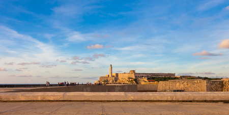 Sunrise, view of the Lighthouse and Castillo del Morro, a fortress guarding the entrance to Havana bay in Havana, Cubaの写真素材