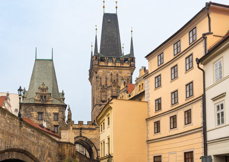 Prague, Czech Republic-February 02, 2019. Tops of the buildings and the Lesser Town (Mala Strana) Bridge Towers of the Charles bridge at old part of Prague city.のeditorial素材