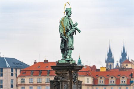 Prague, Czech Republic-February 02, 2019. Statue of saint John of Nepomuk the oldest on the north side of the famous Charles bridge, said to bring good luck to those who touch it.のeditorial素材