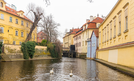 Prague, Czech Republic-February 02, 2019. Certovka (Devils) Canal created in the Middle Ages, on the western side of the Vltava river and Grand Priory water Mill visible from Charles bridge.のeditorial素材