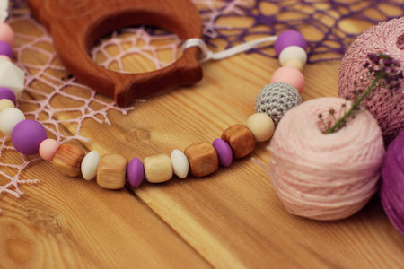 crocheted baby pacifier holder. Yarn balls