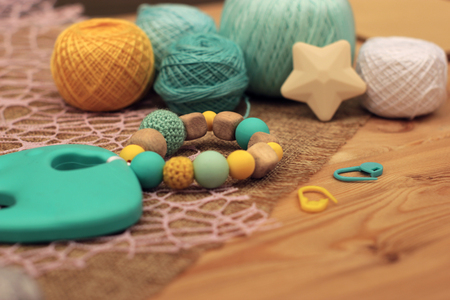 crochet wood and blue and yellow silicon rattleの写真素材
