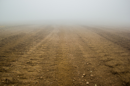 tire track on brown soilの写真素材