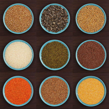 Different types of groats in dish on a brown background. Various groats, cereals. Healthy nutrition foodの写真素材