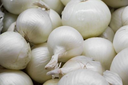 Onions at the open market close up backgroundの写真素材