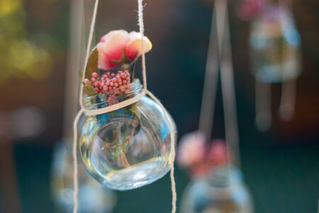 Decoration glass jar hanging with blur garden background. Soft focusの写真素材