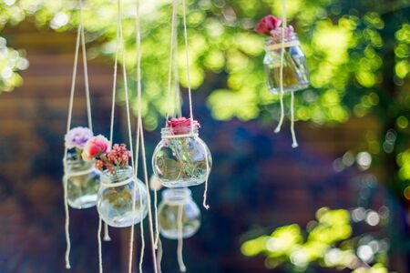 Decoration glass jar hanging with blur garden background. Soft focusの写真素材