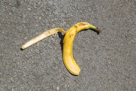 Banana peel was left on the asphalt. The danger may slip. If anyone walks on it.の写真素材
