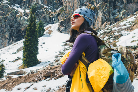Traveling girl with backpack hiking in the mountains, freedom concept. Hiking people on Asia....