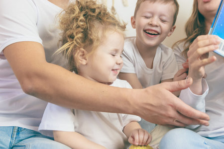 Kids spend time playing. Happy family conceptの写真素材
