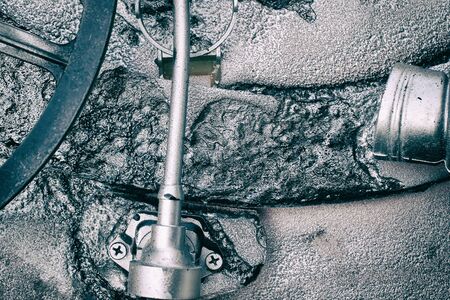Silver grey grunge gears and wheels create an industrial steampunk backgroundの写真素材