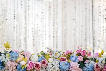 Floral arrangement with wedding flowers on white background with copy spaceの写真素材