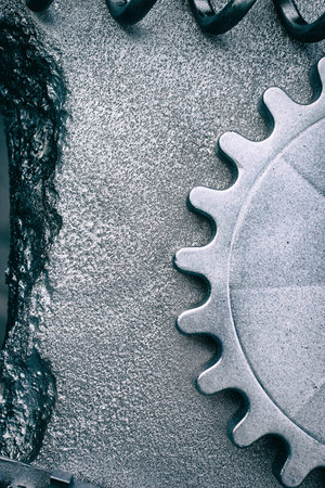 Silver grey grunge gears and wheels create an industrial steampunk background