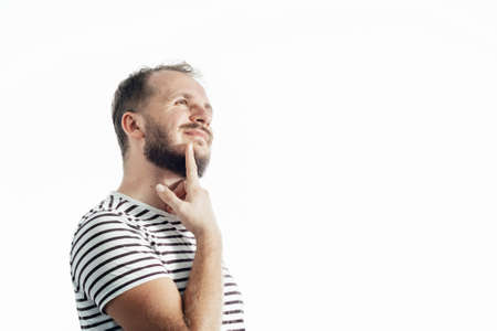 Handsome thinking man over isolated background with one finger, great idea or thought, good memoryの写真素材