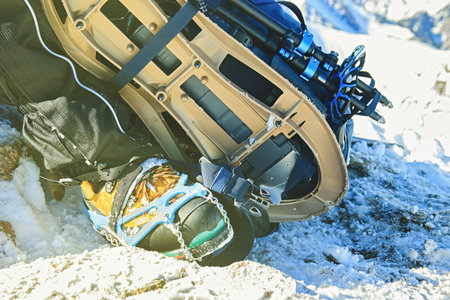 Mountaineering equipment against a snowy landscape. Winter sports, travel and adventure concept.