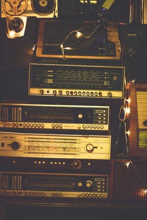 Antique old design boombox radio cassette tape recorders and audio old music player ussr. Vintage style photo background. Verticalのeditorial素材