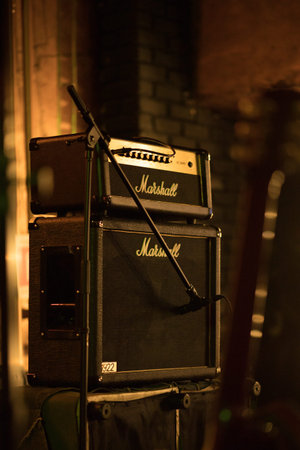 Marshall 100W half stack tube amp head with cabinet, guitar amp on the stage.