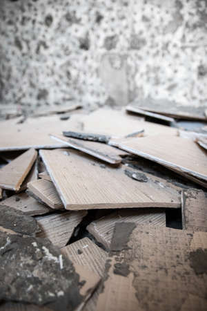 Home improvement and repairs - removing old tiles from walls, vertical background.の写真素材