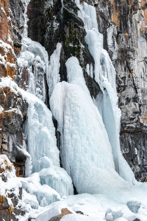 Frozen Butakov Waterfall in the Butakovsky gorge in the suburbs of the city of Almaty in Kazakhstan.の写真素材