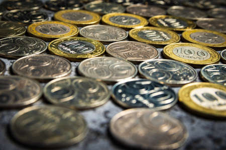 Background from Kazakhstani coins with a face value of 50 and 100 tenge.の写真素材