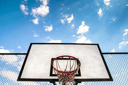 streetball hoop outdoor. Blue sky background and copy space. urban youth game.の写真素材