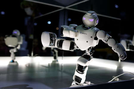 Robot keeps balance while standing on one leg at the exhibition of robots. Almaty, Kazakhstan - February 19, 2022のeditorial素材