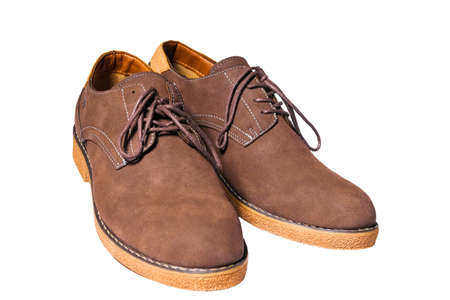Casual brown shoes with laces on a white background.の写真素材