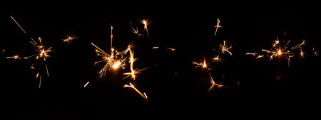 Set of festive sparkler with sparks on black background for overlay blending mode for holiday design...