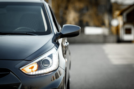 Front optics and side rear view mirror of a gray car Hyundai Accent with copy space. Almaty, Kazakhstan, 05 april, 2022のeditorial素材