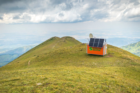 Self-contained rescue hut for hikers on top of the mountain on Furmanov mount. Almaty, Kazakhstan - July 19, 2022のeditorial素材