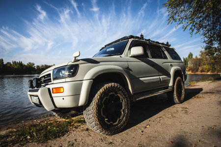 Japanese off-road used white car Toyota Hilux Surf travel on nature. Almaty, Kazakhstan - September...