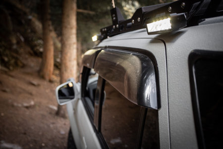 Close up of custom LED side light bar on roof rack off road car.の写真素材