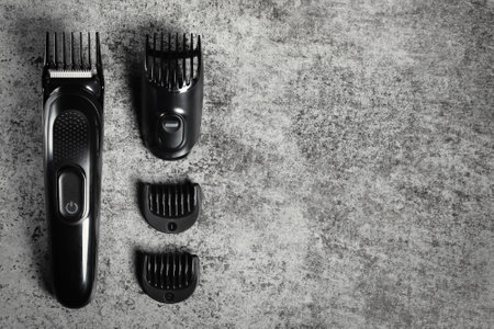 Electric shave machine with attachments. Electric shaver top view with copy space.の写真素材