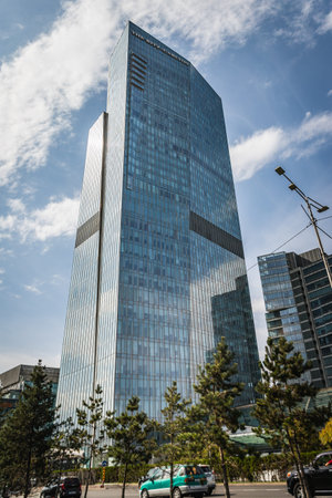 The modern facade of the Ritz-Carlton hotel in Almaty. Almaty, Kazakhstan - September 28, 2022
